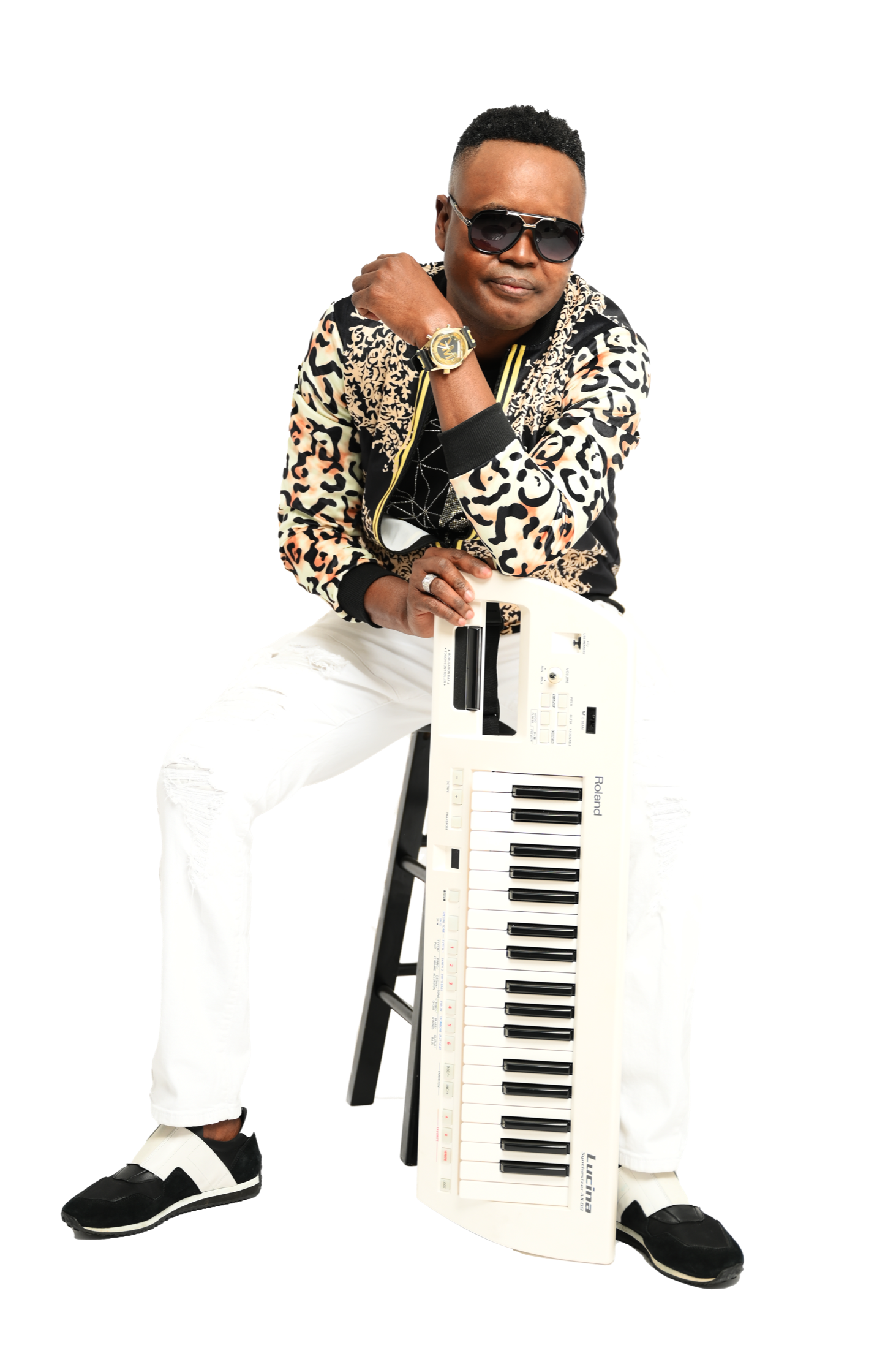 Holby You The Creator posing with a keyboard